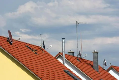 Several antennas on the roofs Stock Photos