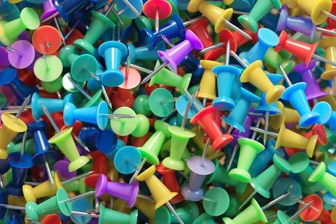 Several assorted colors of plastic push pins Stock Illustration
