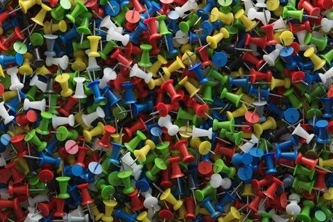 Several assorted colors of plastic push pins Stock Illustration