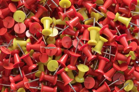 Several assorted colors of plastic push pins Stock Illustration