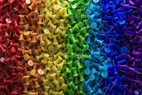 Several assorted colors of plastic push pins Stock Illustration