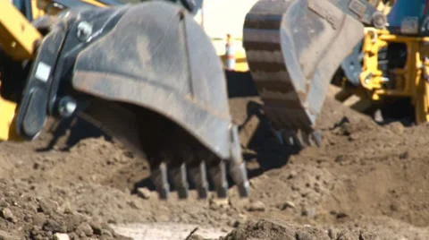 Several backhoe buckets moving dirt Video stock 39863157