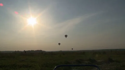 Several balloons flying in the sky during sunset Stock Footage 73127683