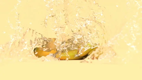 Several bananas on a yellow background in splashes of water Video stock 154218318