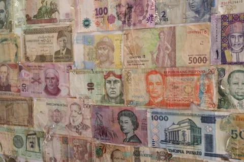 Several banknotes glued on a wal Foto stock