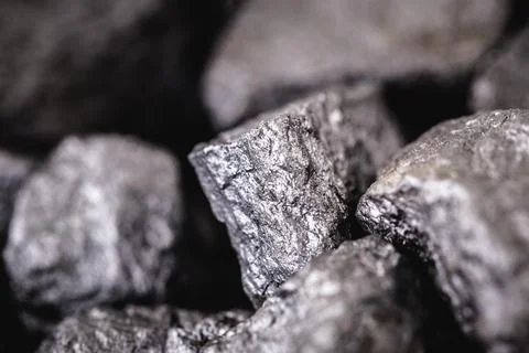 Several bare silver nuggets, texture of silvery stones. Stock Photos