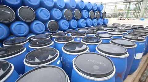 Several barrels at storage yard in refinery Plant Stock Footage 52095662