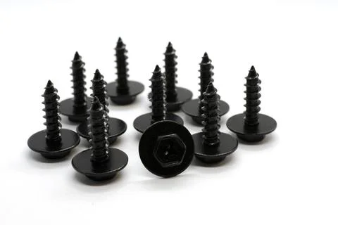 Several black tapping screws in a group on Stock Photos