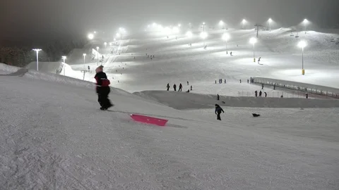 Several boys going up pulling sleds in Levi ski resort in Finland in snowy Stock-Footage 123087736