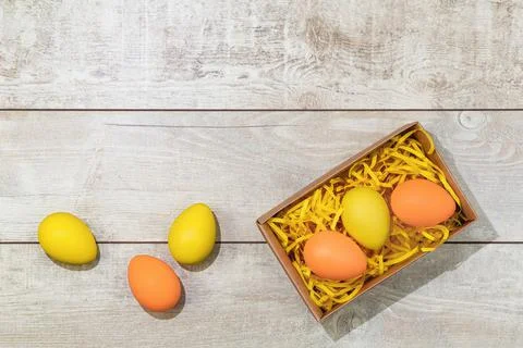 Several bright color dyed easter eggs on wooden background Stock Photos