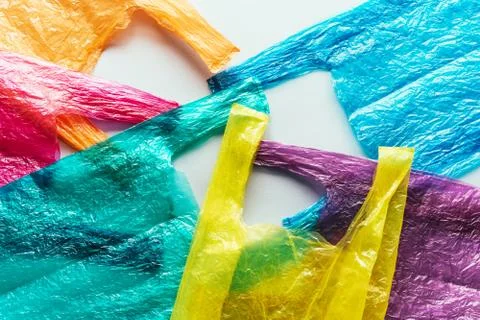 Several bright colored disposable plastic bags Foto stock