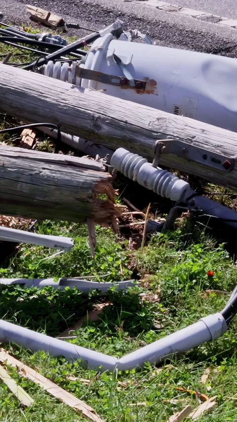 Several broken power lines lie crashed wires on ground following a storm Vídeo Stock 289392362