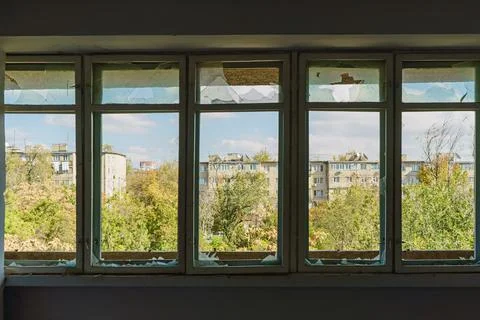 Several broken windows inside the room Stock Photos