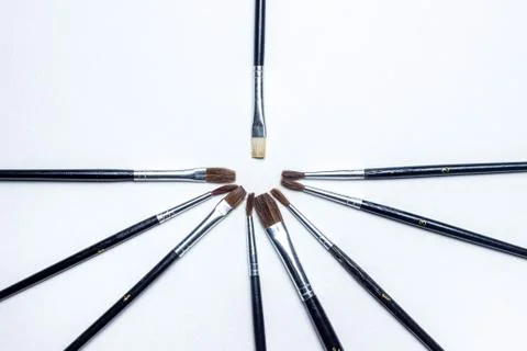 Several brushes lie around one brush Stock Photos