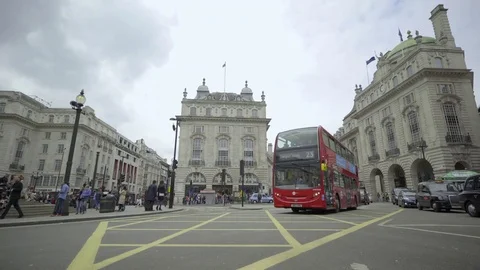 Several buses and cabs pass by Stock Footage 83601666