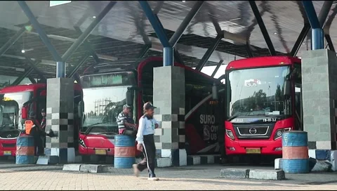 Several buses lined up parked at purabaya or bungurasih terminal. Stock Footage 303570729