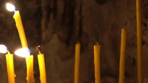 Several candles being blown out slowly Stock Footage 79810091