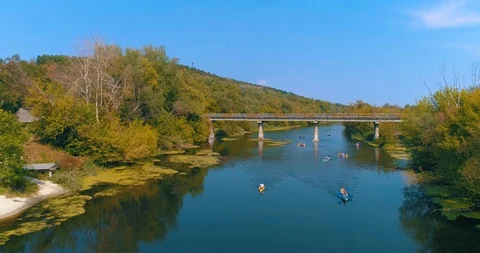 Several Canoes Float Across The River Drone Video 库存影片 98941691