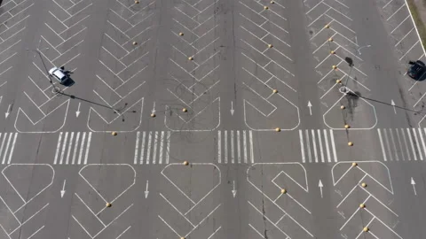 Several cars in the middle of a large empty parking lot outside the supermarket Stock Footage 133188748