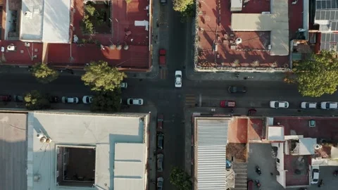 Several cars over a level intersection stop in line and follow the traffic Stock Footage 170925678