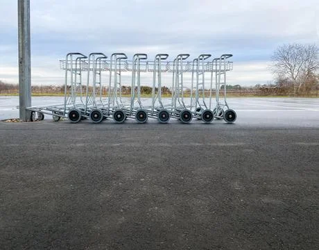 Several carts for transporting luggage at an empty bus station Stock Photos