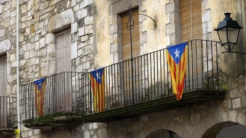 Several Catalonian flags are hanging on a balcony Stock Footage 99175956