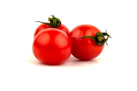 Several cherry tomatoes on a white background. Foto stock