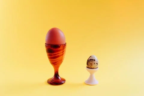 Several chicken easter eggs on a yellow background Stock Photos