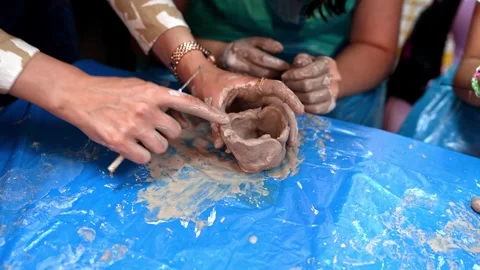 Several Children Make Shapes From Ceramic Mud Stock Footage 241722837
