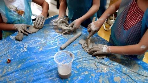 Several Children Make Shapes From Mud 스톡 동영상 241722715
