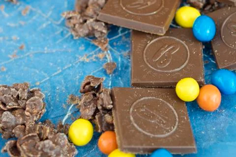 Several chocolate sweets on blue background Stock Photos