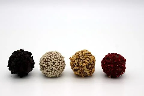 Several chocolates on white background Stock Photos