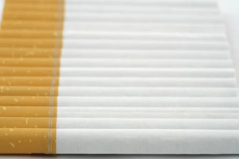 Several cigarettes stacked on table Foto stock