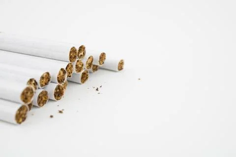 Several cigars on white background. Filtered cigarettes. Tobacco. Stock Photos
