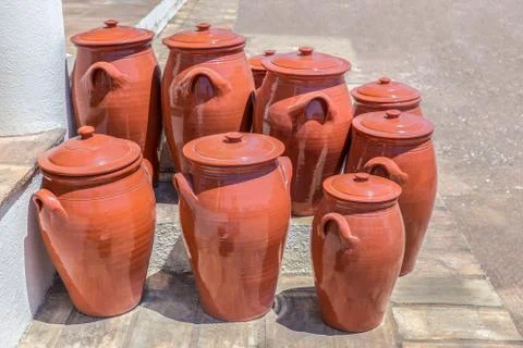 Several clay pots on floor outside pottery Stock Photos