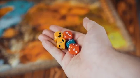 Several Colored Dices Fall On a Table With Boardgame Stock Footage 72639387