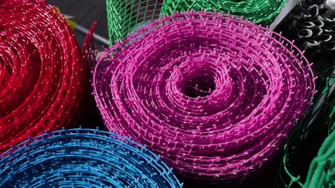 Several colored rolls of plastic mesh are in the store. Video stock 191411068