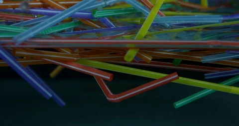 Several Colourful Plastic Straws Floating Around In The Sea. Plastic Pollutio Stock Footage 111937001