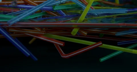 Several Colourful Plastic Straws Floating Around In The Sea. Plastic Pollution Stock Footage 112835402