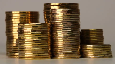 Several Columns of Coins Spinning Видео 46325311