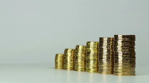 Several Columns of Coins Spinning Video stock 47137228