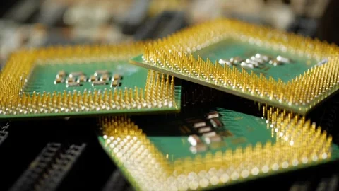 Several computer microprocessors lie on the motherboard close-up Video stock 283442774