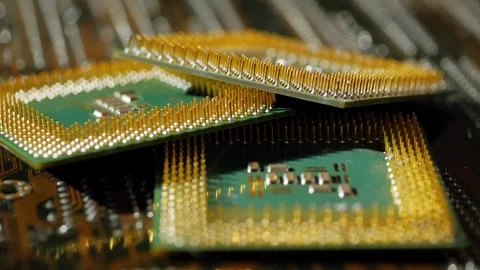 Several computer microprocessors lie on the motherboard close-up Stockbeeldmateriaal 283442817