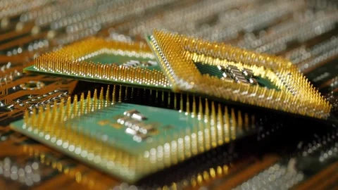 Several computer microprocessors lie on the motherboard close-up Stockbeeldmateriaal 283442838