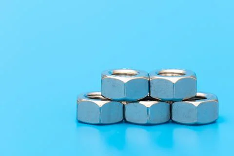 Several construction hex nuts shot in close-up photo Stock Photos