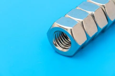 Several construction hex nuts shot in close-up photo Stock Photos