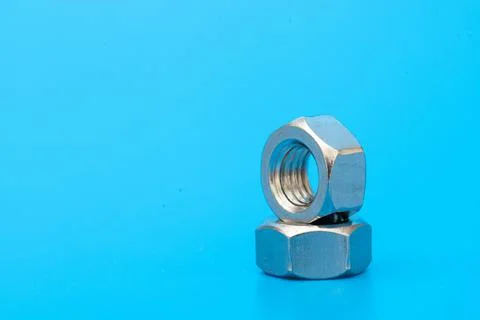 Several construction hex nuts shot in close-up photo Stock Photos