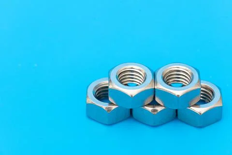 Several construction hex nuts shot in close-up photo Stock Photos