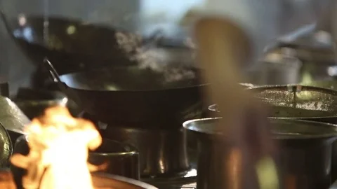 Several cooks are cooking in the kitchen of a restaurant. Stock Footage 70241374