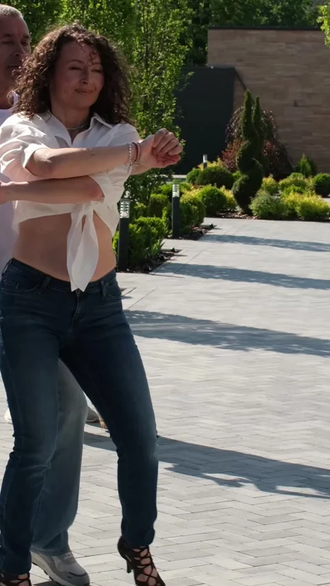 Several couples in jeans and T-shirts dance in nature Guy and girl dance Stock Footage 276962648